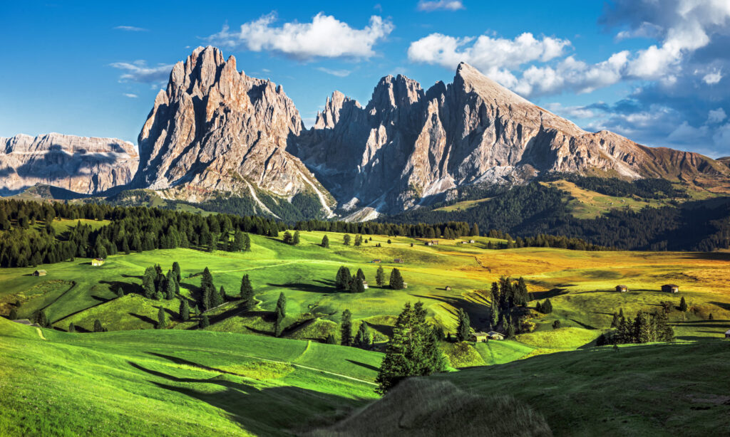 Famous Alpe di Siusi in the Dolomites, Langkofel mountain group in background at sunset