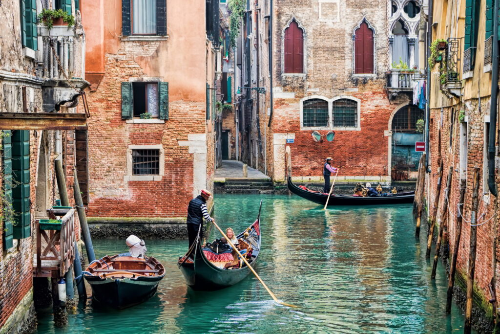 Typical Venetian Gondolas in the Canals of Venice