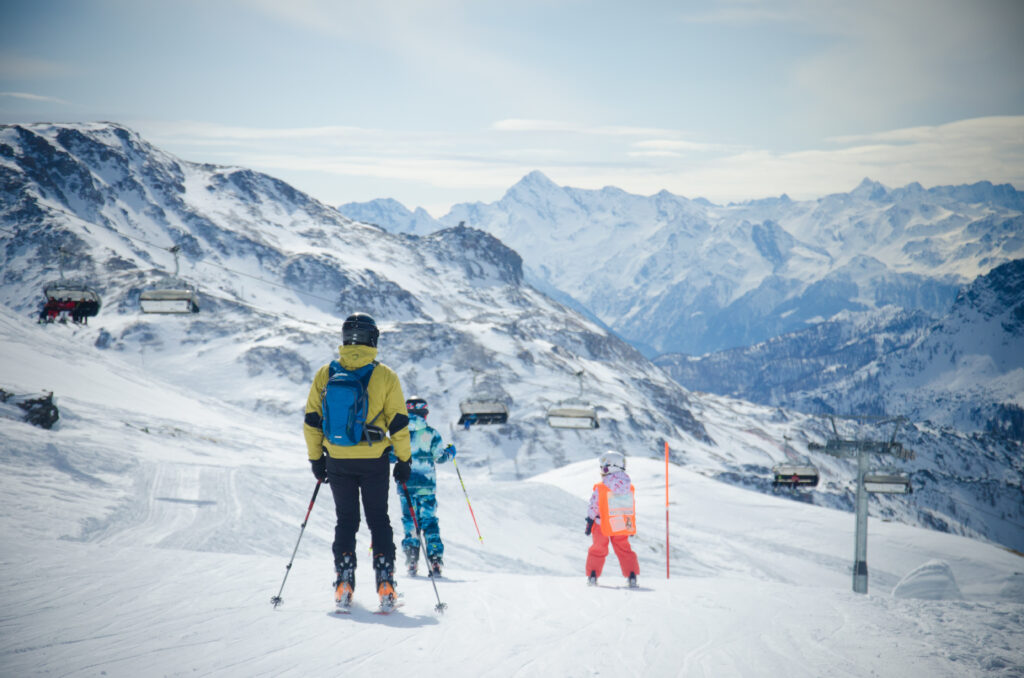 Landscape of the snow-covered mountains and skiers in Cervinia