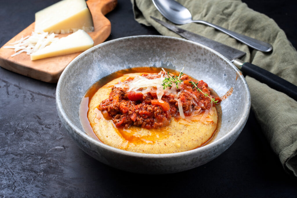 Traditional Italian Polenta Sardinian style with salsiccia and pecorino