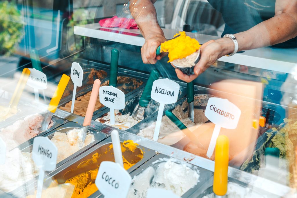 Woman having ice cream in an Italian ice cream shop